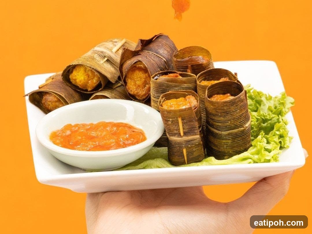 Food Wrapped in Leaves with Dipping Sauce