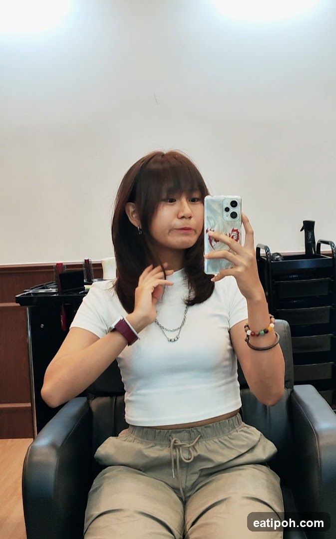Woman taking a selfie in a salon
