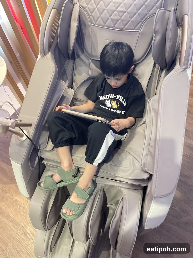 Boy sitting in a massage chair
