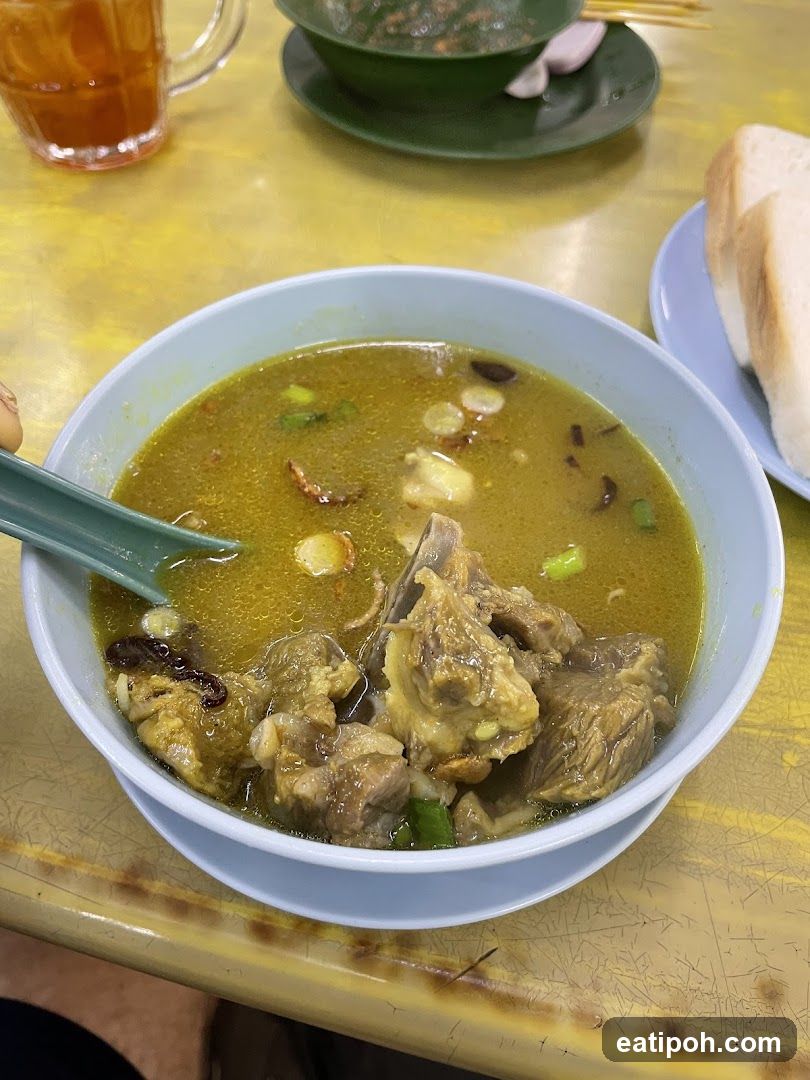 Bowl of Soup with Meat and Bread