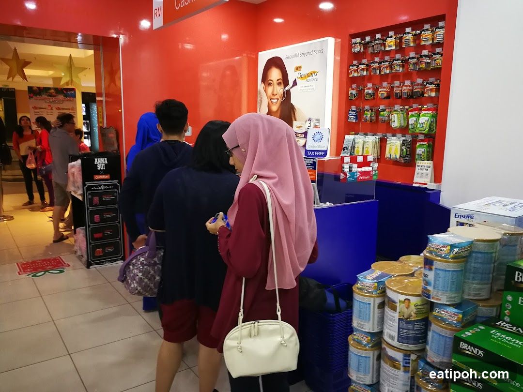 Pharmacy Counter with Customers