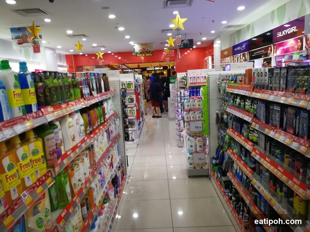 Aisle in a store with shelves stocked with health and beauty products.