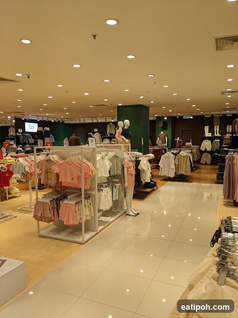 Clothing store interior with mannequins and apparel displays