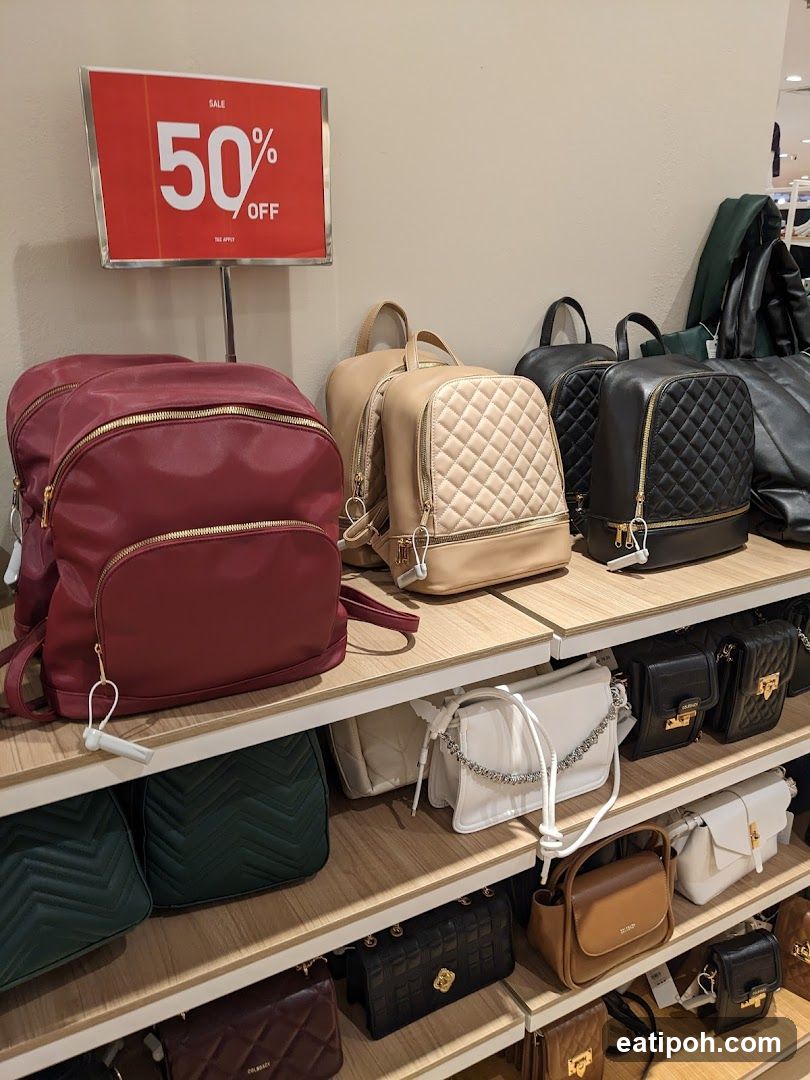 Bags on display with sale sign