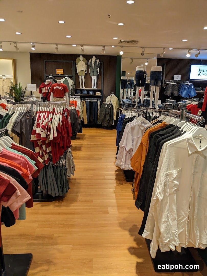 Clothing store interior with mannequins and apparel
