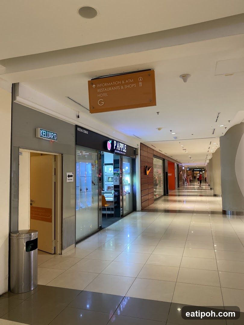 Mall Interior with Shops and Signage
