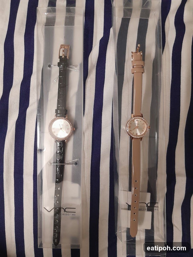 Two women's watches in packaging