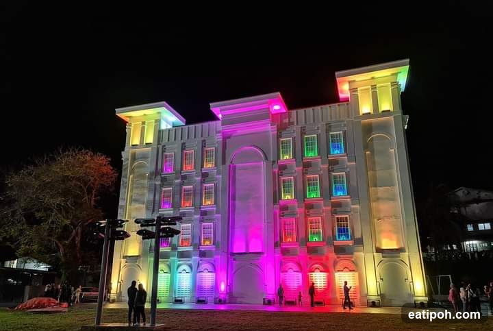 Building illuminated with colorful lights at night