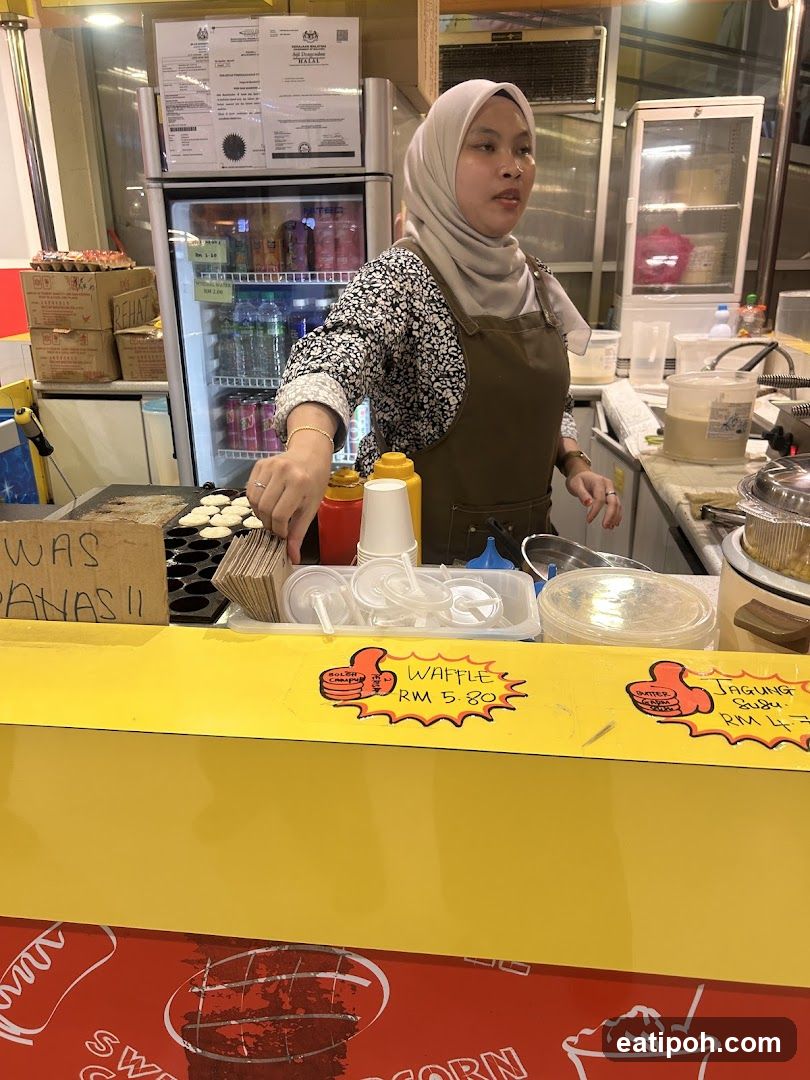 Food stall with waffle and corn offerings