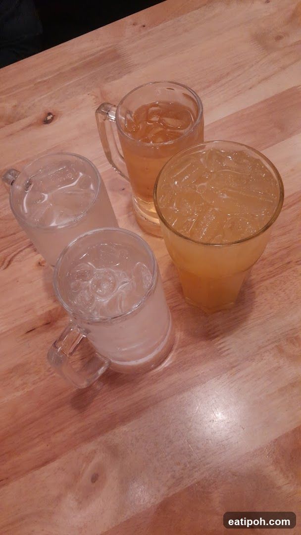 Four drinks on a wooden table