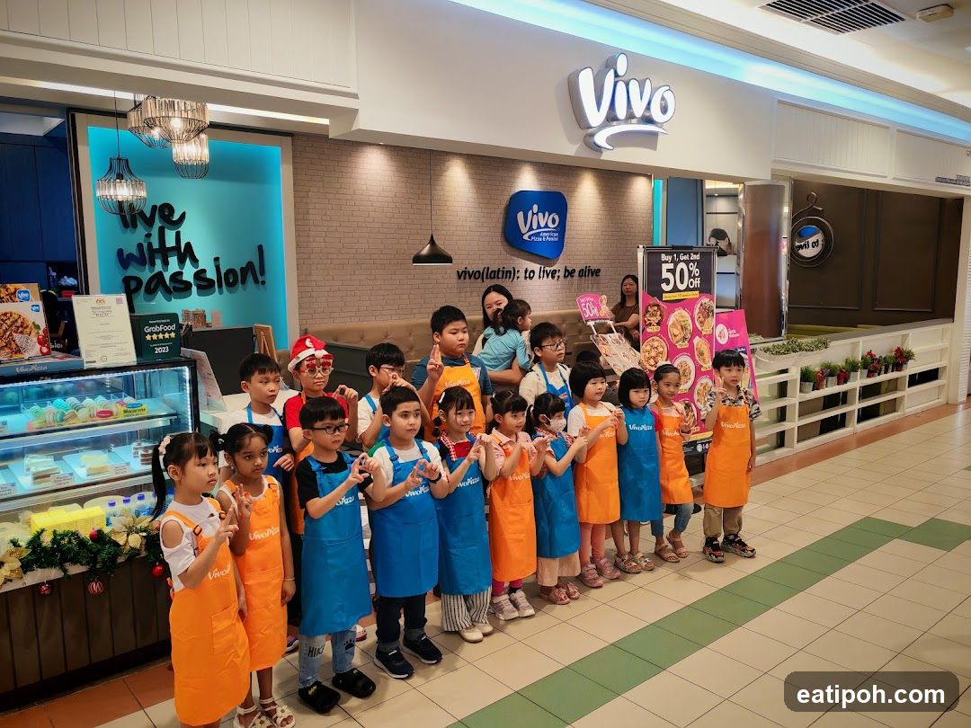 Children in aprons at Vivo Pizza