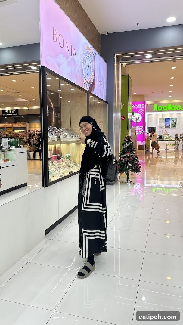Woman posing in front of a Bonia store