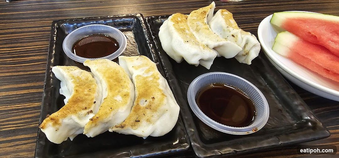 Pan-fried dumplings and watermelon slices