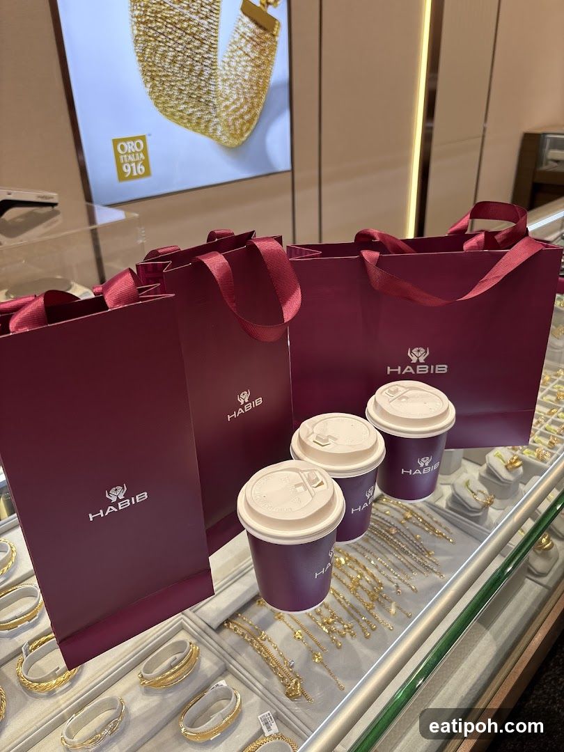 Jewelry Store Display with Branded Bags and Coffee Cups