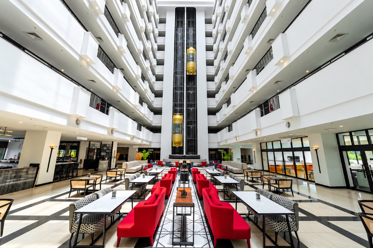 The Atrium restaurant at Dusit Princess Ipoh with views toward Ipoh's limestone hills