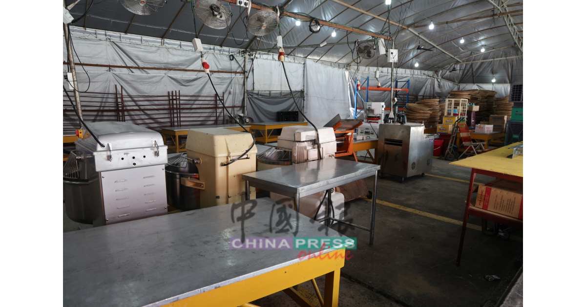 Wooden moulds and steamers ready for red tortoise bun production at Dou Mu Gong, Ipoh