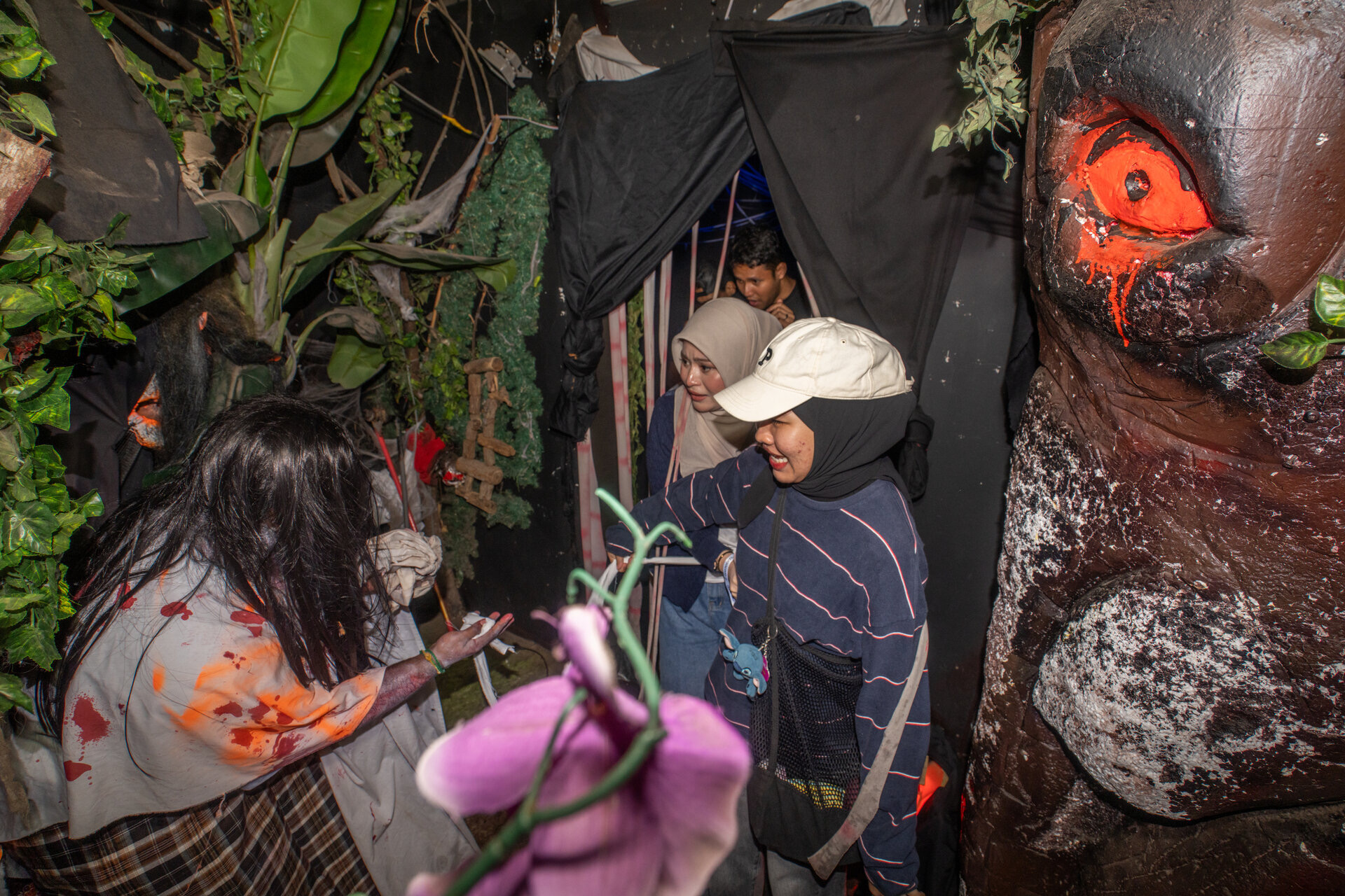 Visitors walking a Screamfest 5 haunted house at Lost World of Tambun, Ipoh